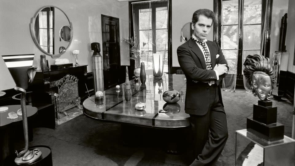 Also in his Rue de l’Université residence, Lagerfeld poses in his sitting room for a photo spread published in a German magazine, circa 1972. - Max Scheler/Süddeutsche Zeitung Photo/Alamy Stock Photo/Courtesy Thames & Hudson