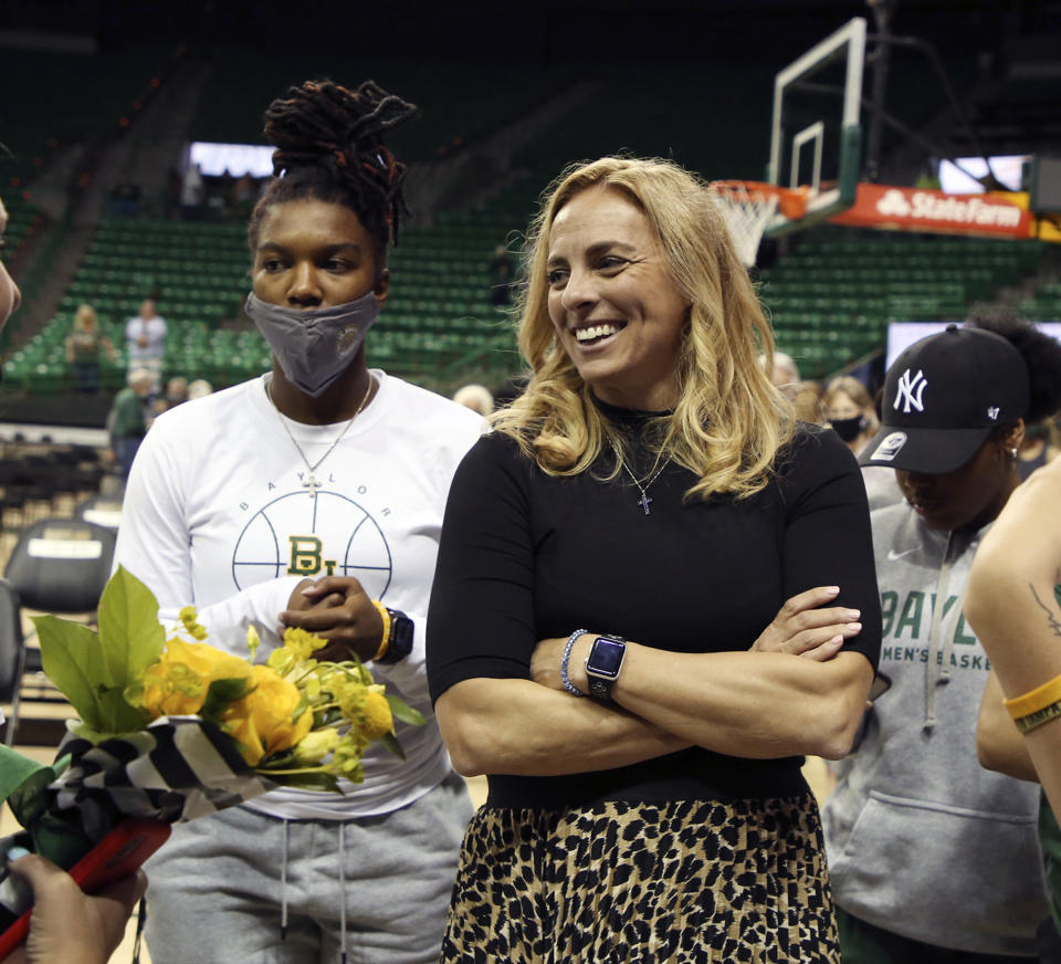Nicki Collen is greeted by players after being introduced as the women's head basketball coach at the Ferrell Center after a public ceremony, Wednesday, May 5, 2021, in Waco, Texas. (Rod Aydelotte/Waco Tribune-Herald via AP)