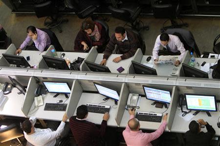 Traders work at the Egyptian stock exchange in Cairo April 1, 2014. REUTERS/Mohamed Abd El Ghany