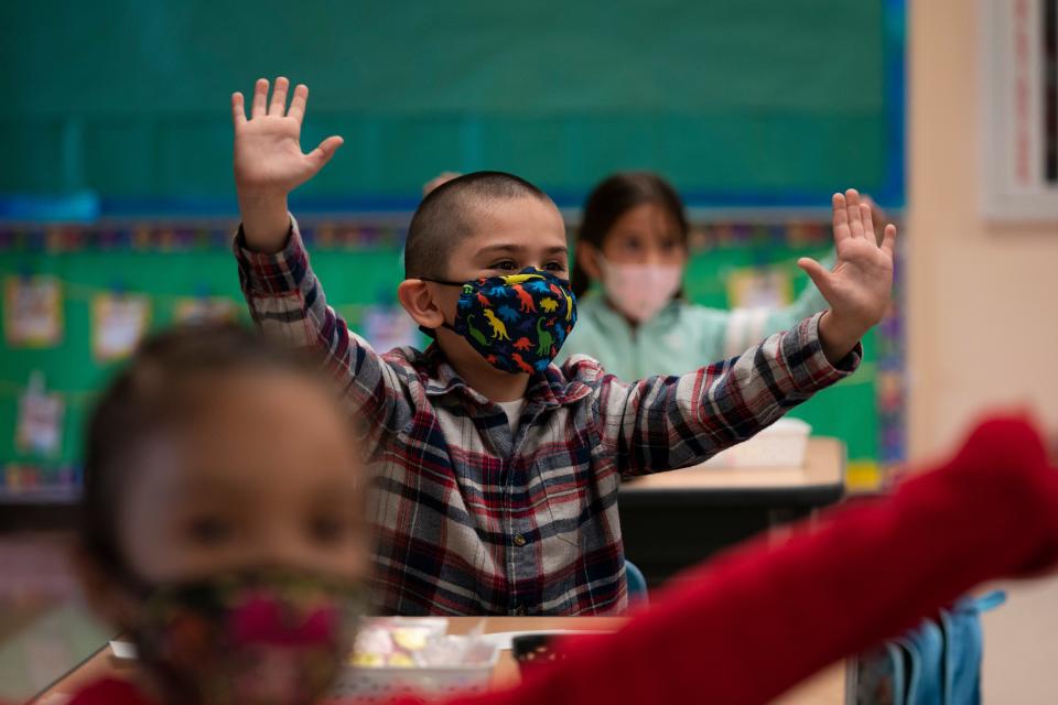 Kindergarten students participate in a classroom activity on the first day of in-person learning at Maurice Sendak Elementary School in Los Angeles on Tuesday, April 13, 2021. Some schools were closed for more than a year due to the pandemic.