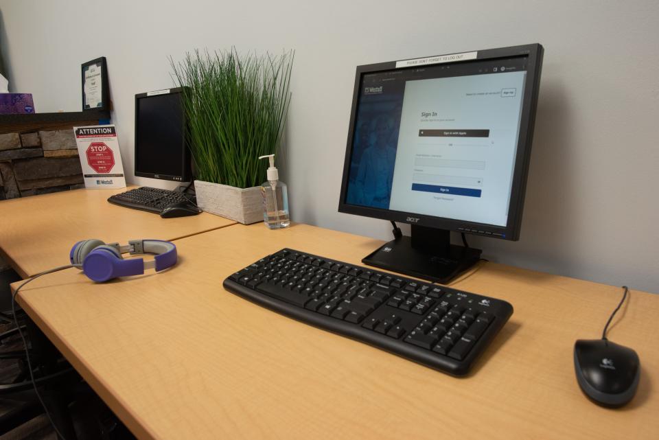 Computers sit in the lobby of Westaff, 1315 S.W. 6th Ave., for job seekers to fill out applications and sign into the system. Westaff helps connect potential employees with employers.