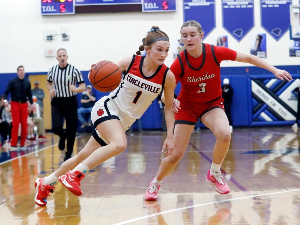 Circleville's Faith Yancey drives on Thornville Sheridan's Ava Heller during their Division II district final Wednesday at Chillicothe Southeastern. Sheridan, which is coached by Pickerington Central graduate J.D. Walters, won 50-30.