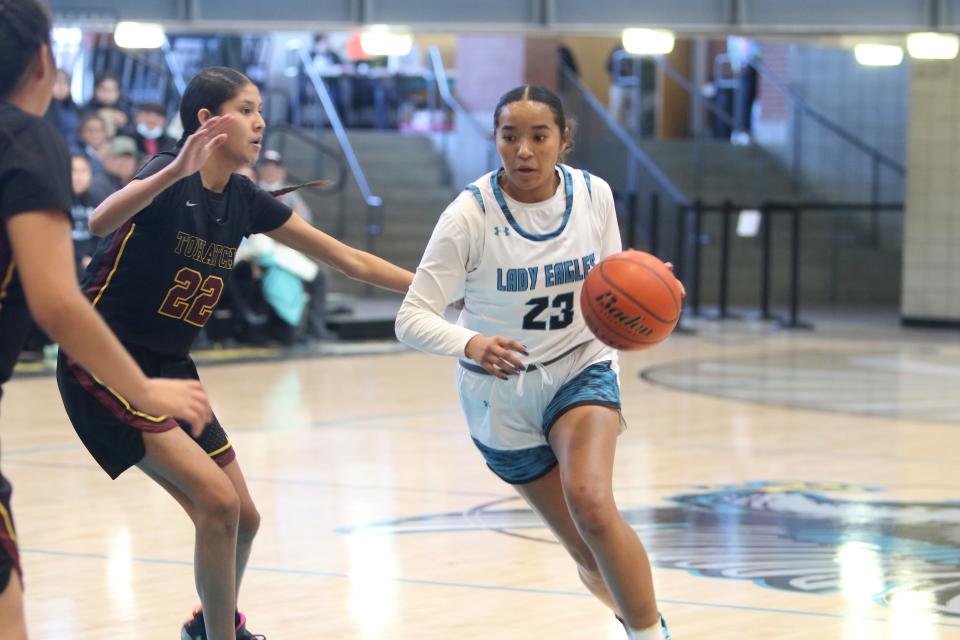 Navajo Prep's Aniya Johnson looks for a lane to the basket while being guarded by Tohatchi's WynterRose Sheka` during the first quarter of a district basketball game, Saturday, Jan. 21, 2023 at the Eagles Nest.