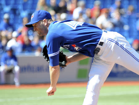 Toronto Blue Jays' J.A. Happ pitches against the Tampa Bay Rays in the first inning of their MLB American League baseball game in Toronto September 28, 2013. REUTERS/Jon Blacker