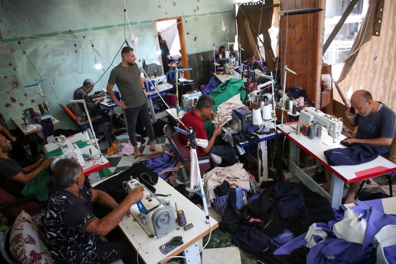 Damaged Gaza sewing factory reopens as tailors struggle to make ends meet