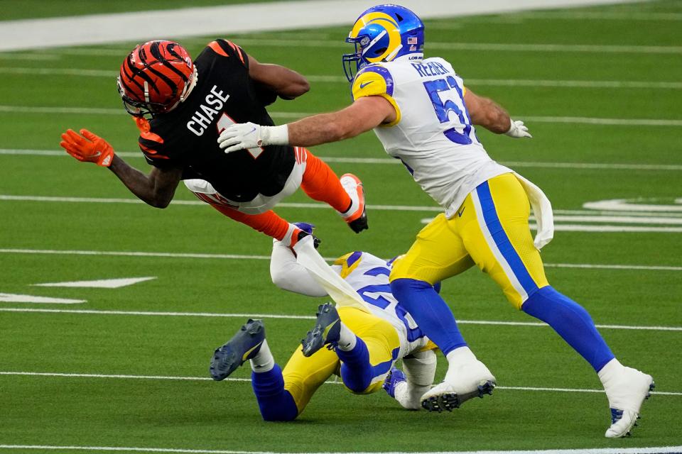 Cincinnati Bengals wide receiver Ja'Marr Chase (1) runs against Los Angeles Rams inside linebacker Troy Reeder (51) during the first half of the NFL Super Bowl 56 football game Sunday, Feb. 13, 2022, in Inglewood, Calif. (AP Photo/Julio Cortez)
