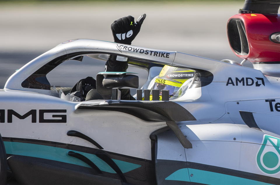 Mercedes driver Lewis Hamilton, of Britain, gestures to the crowd after finishing third in the Canadian Grand Prix auto race in Montreal, Sunday, June 19, 2022. (Graham Hughes/The Canadian Press via AP)