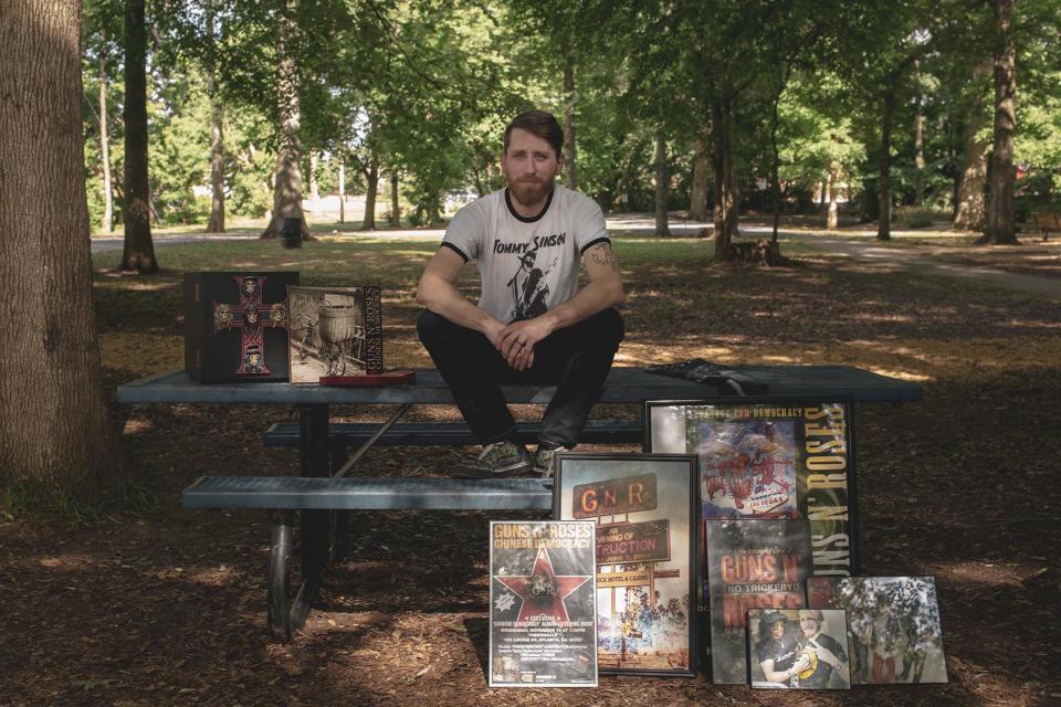 May 31, 2022 - TUPELO, MS: Rick Dunsford stands for a portrait at a park near his home. Dunsford is a hardcore Guns-N-Roses fan and memorabilia collector that got caught up in allegations of leaking unreleased music by the band. 

Photo by Andrea Morales