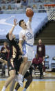 North Carolina's Walker Kessler (13) secures an offensive rebound over Florida State's Balsa Koprivica (5) during the first half on Saturday, Feb. 27, 2021, in Chapel Hill, N.C. (Robert Willett/The News & Observer via AP)