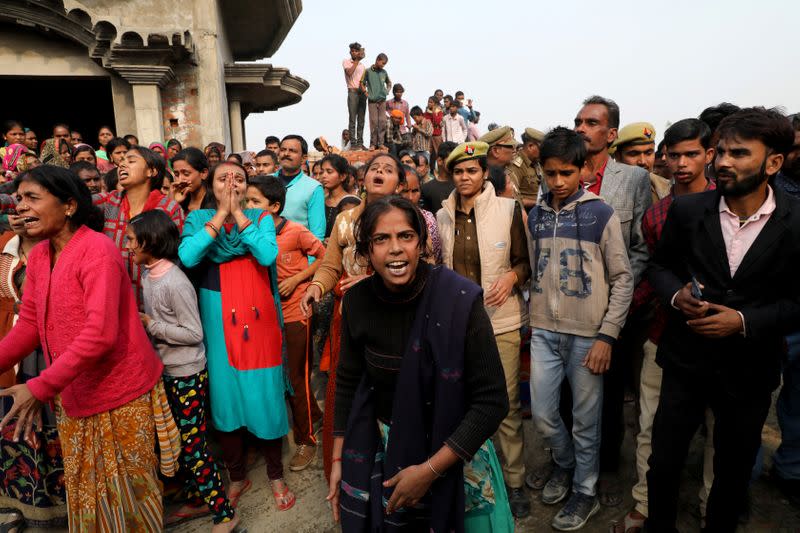 Relatives of the accused react as they demand a Central Bureau of Investigation probe into the rape of a 23-year-old victim, who died in a New Delhi hospital on Friday, after she was set on fire by a gang of men, which included her alleged rapists, i