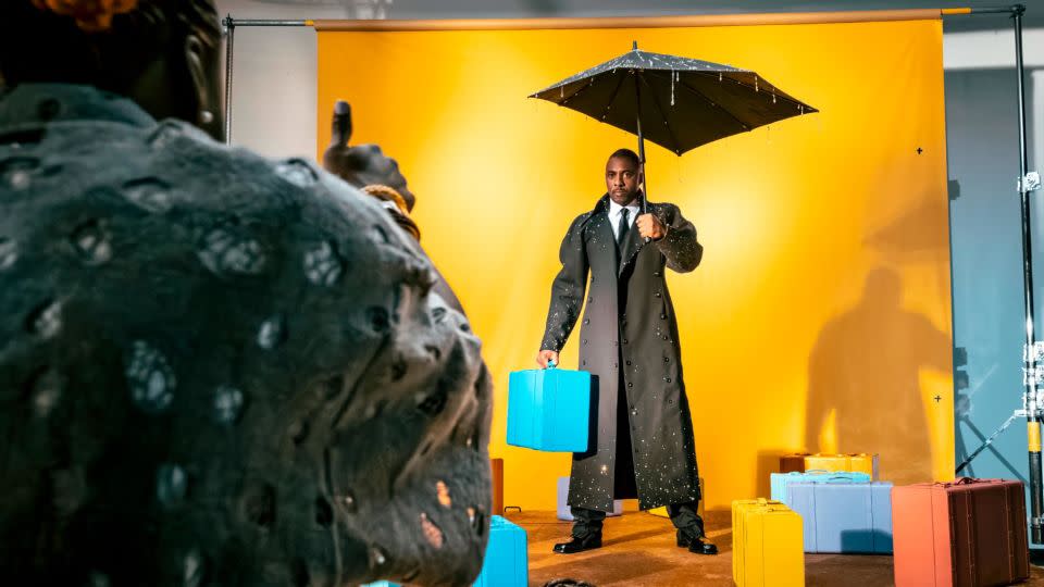 Idris Elba braves the weather and gets the thumbs up mid-shoot. The actor has Ghanaian ancestry on his mother's side. - Alessandro Scotti