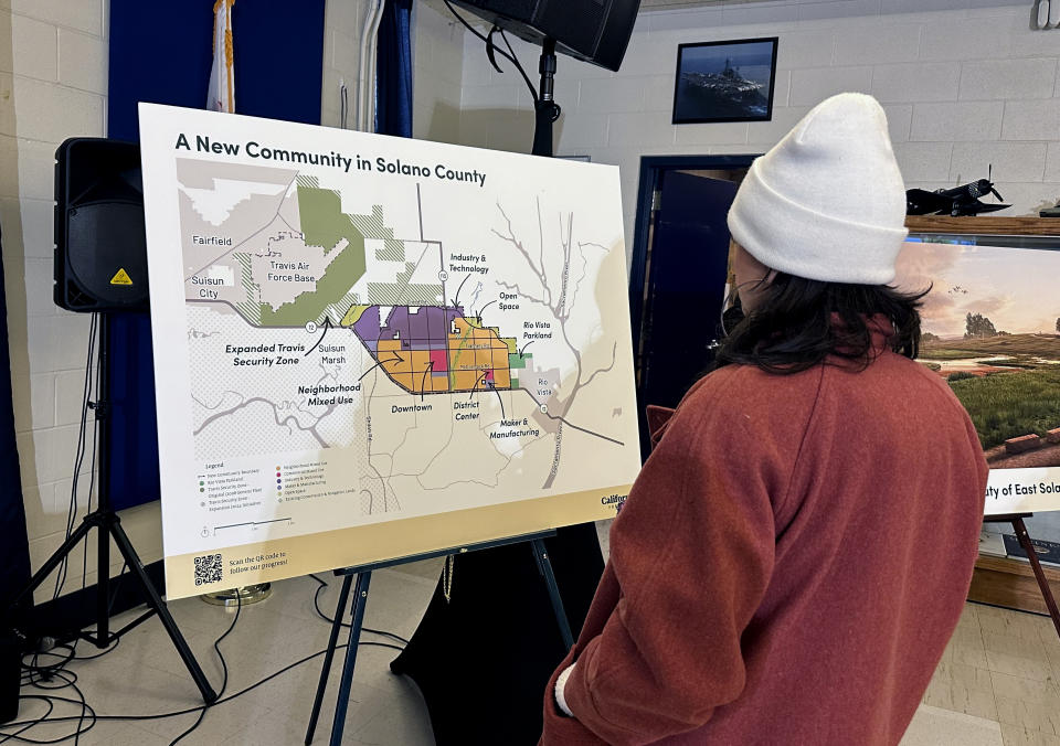 A map of a new proposed community in Solano County, California is displayed during news conference in Rio Vista, Calif. on Wednesday, Jan. 17, 2024. A company backed by Silicon Valley billionaires that stealthily snapped up more than $800 million dollars worth of rural land for what it has said will be a new utopian green city between San Francisco and Sacramento is now taking the pitch to voters. (AP Photo/Janie Har)