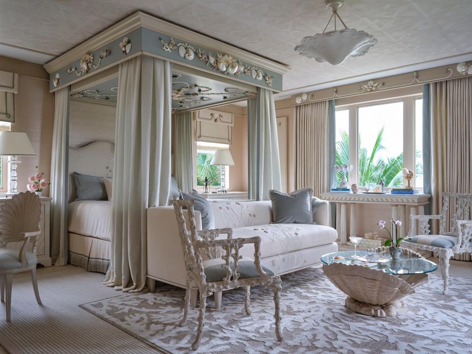 For a second-floor bedroom at the Kips Bay Decorator Show House Palm Beach, designer Cindy Rinfret asked seashell artist Robin Grubman to embellish the canopy bed with shells.