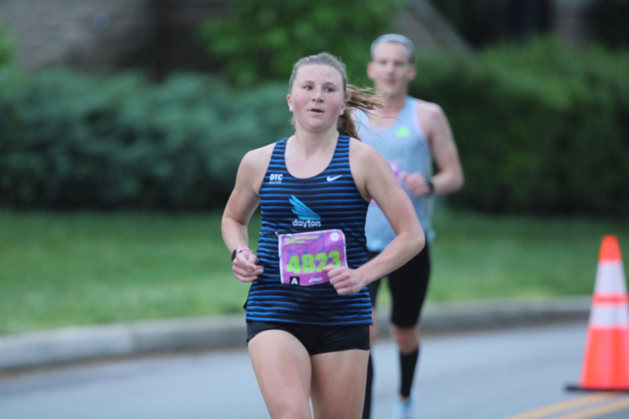 Olivia Anger, shown in the middle of the 2024 Flying Pig Marathon, won the women's race.