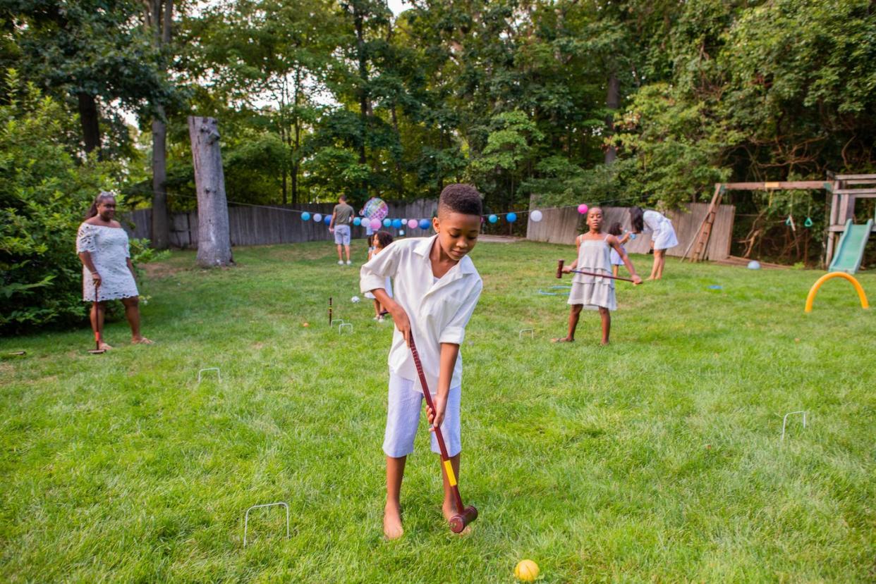 children playing cricket at lawn party