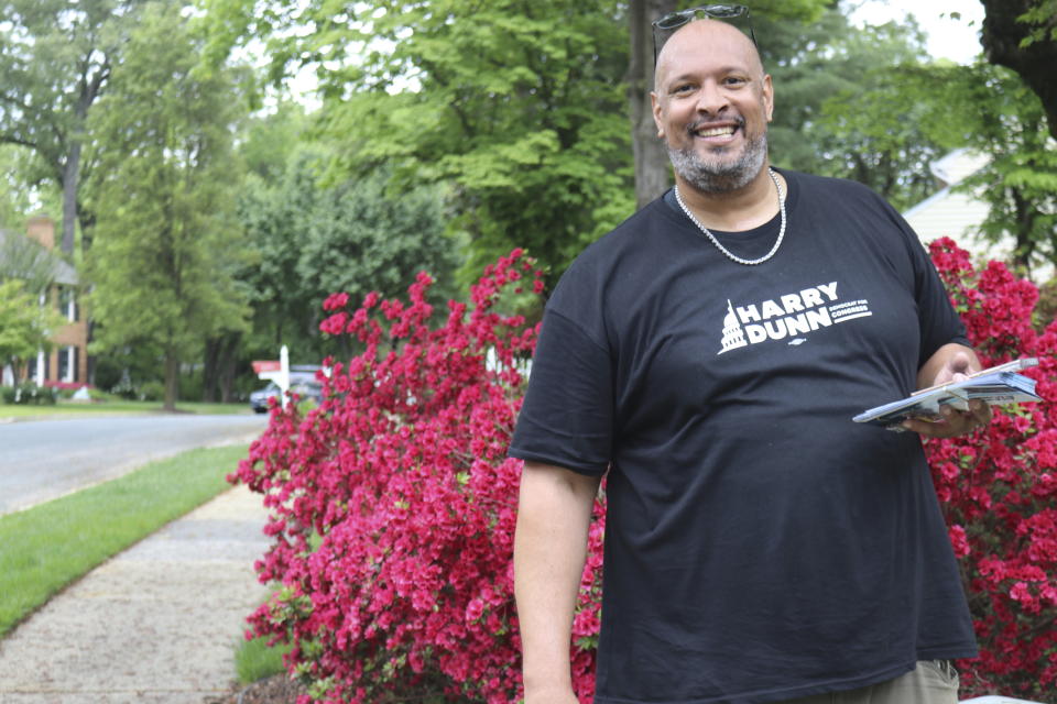 Harry Dunn, the former U.S. Capitol police officer who defended the Capitol against rioters on Jan. 6, 2021, smiles as he campaigns in the Democratic primary for Maryland's 3rd Congressional District on Saturday, May 11, 2024 in Millersville, Md. (AP Photo/Brian Witte)