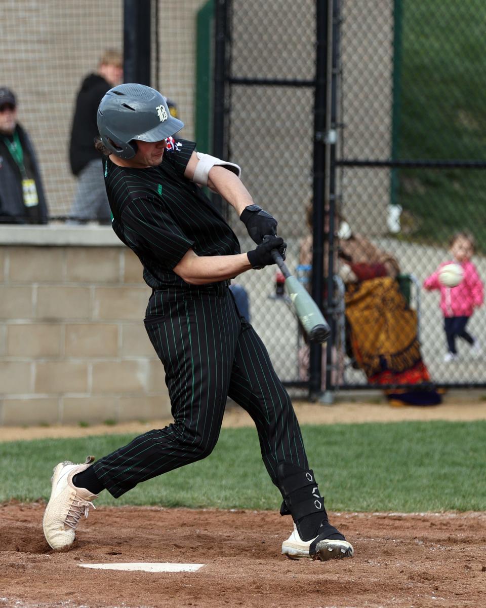 Badin catcher Jimmy Nugent gets a base hit in the game with McNicholas March 30, 2022, at McNicholas.