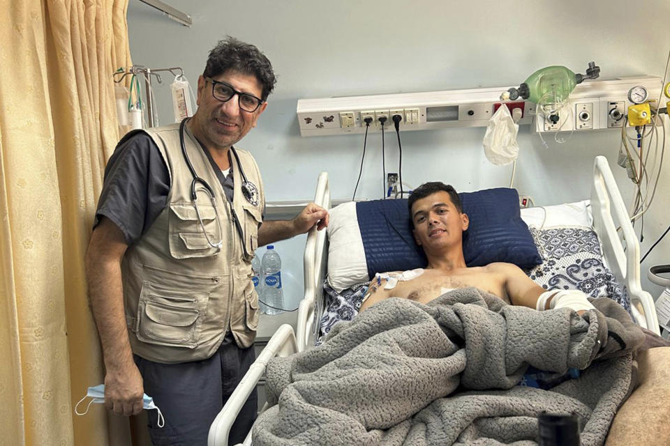 Dr. Ammar Ghanem, an ICU specialist from Detroit volunteering in one of Gaza's last functioning hospitals, stands by a young patient recovering from pneumonia on May 9, 2024, in Khan Younis, Gaza. A group of 35 foreign doctors on a volunteer mission to help at the hospital, including 22 Americans, have been trapped in Gaza by Israel’s seizure of the Rafah crossing into Egypt.