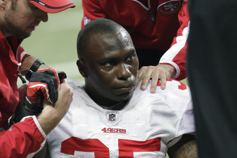 FILE - In this Dec. 26, 2010 file photo, San Francisco 49ers cornerback Phillip Adams (35) is attended to after injuring his left leg during the third quarter of an NFL football game against the St. Louis Rams, in St. Louis. A source briefed on a mass killing in South Carolina says the gunman who killed multiple people, including a prominent doctor, was the former NFL pro. The source said that Adams shot himself to death early Thursday, April 8, 2021. (AP Photo/Tom Gannam, File)