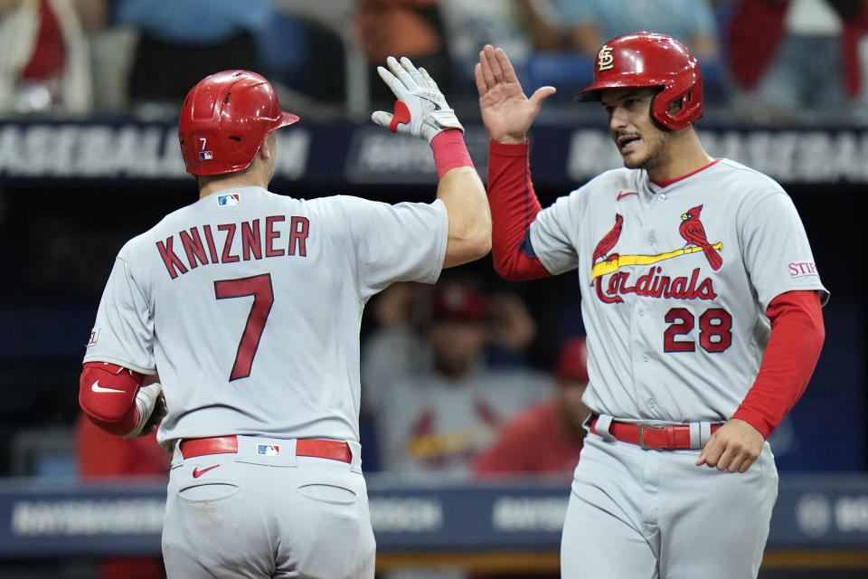 St. Louis Cardinals' Andrew Knizner (7) celebrates with Nolan Arenado (28) after Knizner hit a two-run home run off Tampa Bay Rays pitcher Zack Littell during the fourth inning of a baseball game Thursday, Aug. 10, 2023, in St. Petersburg, Fla. (AP Photo/Chris O'Meara)