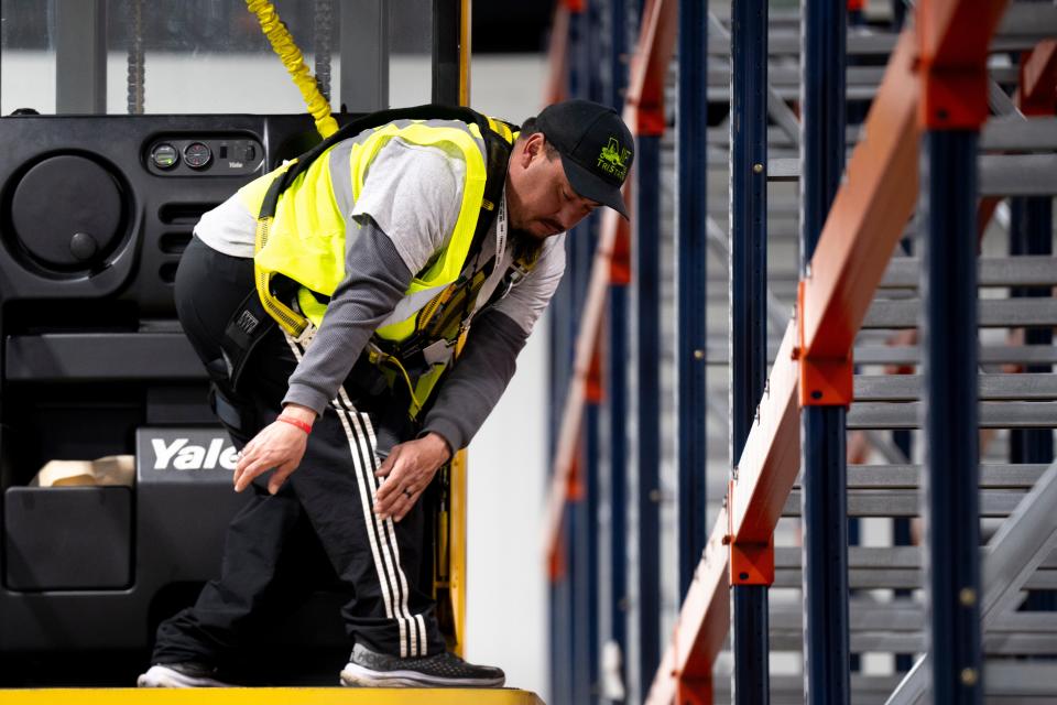 ChrisGlass practices using a cherry picker machine during a LIFT program class at the Freestore Foodbank in Cincinnati on Feb. 20.