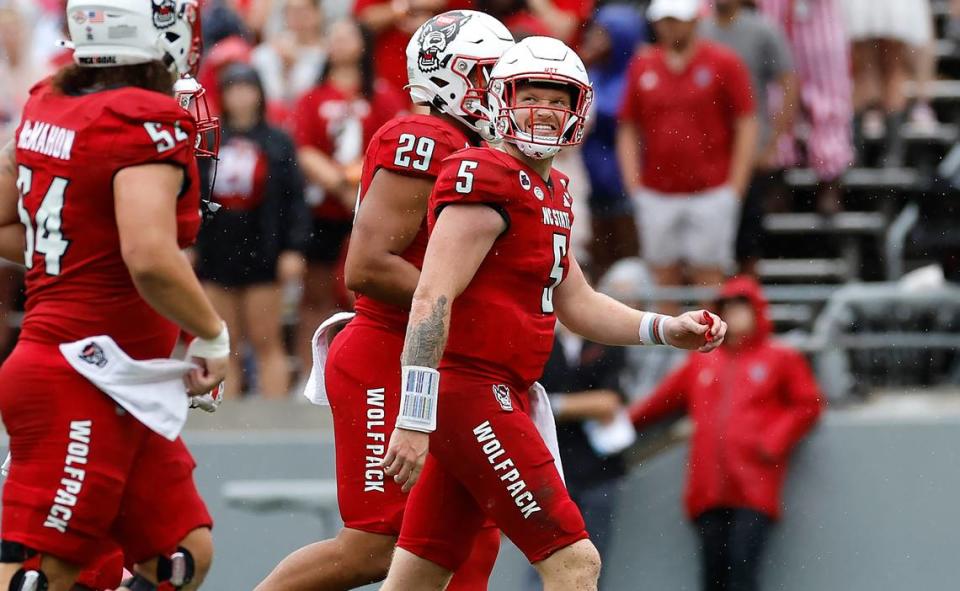 N.C. State quarterback Brennan Armstrong (5) looks to the scoreboard as he walks off the field after throwing an interception during the first half of N.C. State’s game against Notre Dame at Carter-Finley Stadium in Raleigh, N.C., Saturday, Sept. 9, 2023.