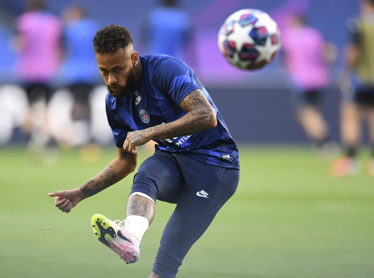 PSG's Neymar kicks the ball during the warm up ahead of the Champions League quarterfinal match between Atalanta and PSG at Luz stadium, Lisbon, Portugal, Wednesday, Aug. 12, 2020. (David Ramos/Pool Photo via AP)