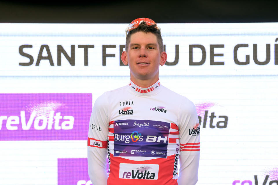 SANT FELIU DE GUIXOLS SPAIN  MARCH 20 Jetse Bol of The Netherlands and Team BurgosBH celebrates at podium as Red mountain jersey winner during the 102nd Volta Ciclista a Catalunya 2023 Stage 1 a 1646km stage from Sant Feliu de Guxols to Sant Feliu de Guxols  VoltaCatalunya102  on March 20 2023 in Sant Feliu de Guixols Spain Photo by David RamosGetty Images