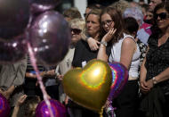 <p>People hold a minute of silence in a square in central Manchester, England, Thursday, May 25, 2017, after the suicide attack at an Ariana Grande concert that left more than 20 people dead and many more injured, as it ended on Monday night at the Manchester Arena. (AP Photo/Emilio Morenatti) </p>