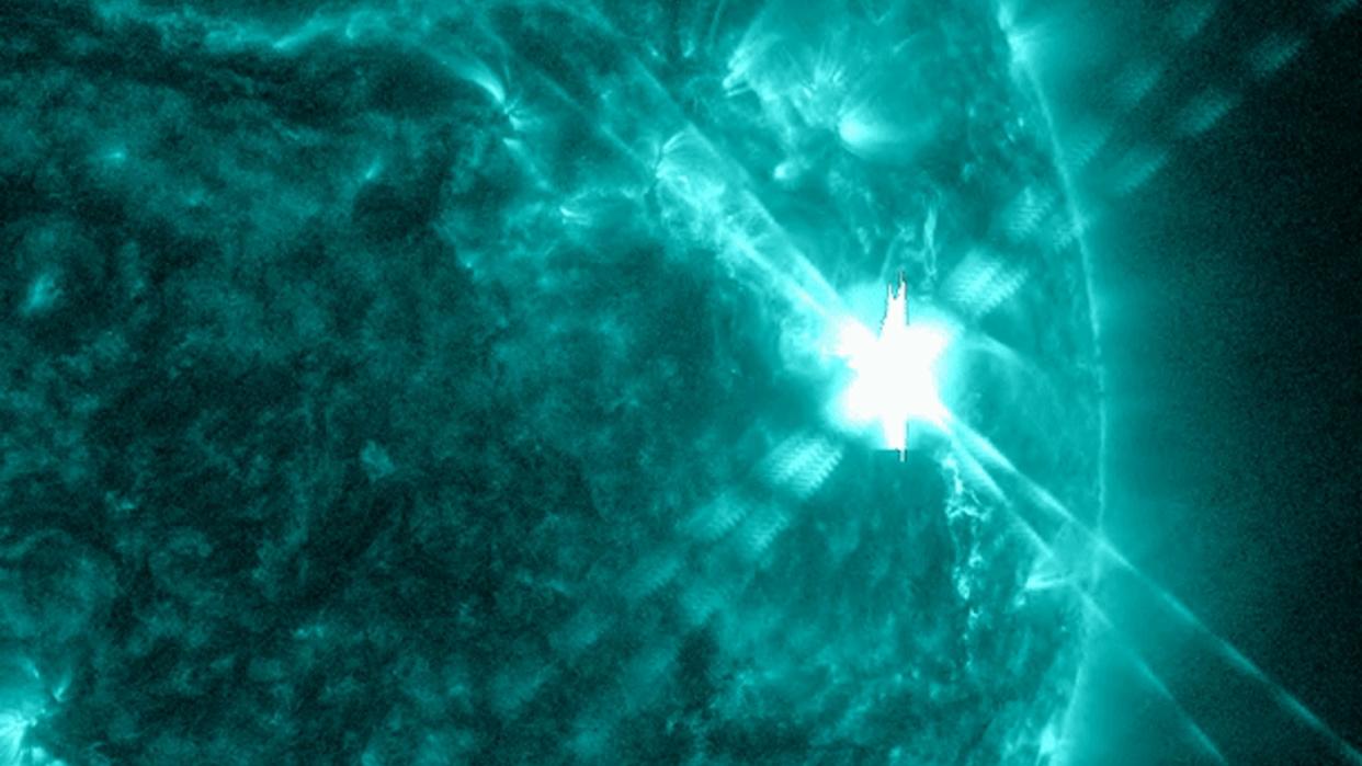  A bright flash on the sun as the solar flare explodes. 