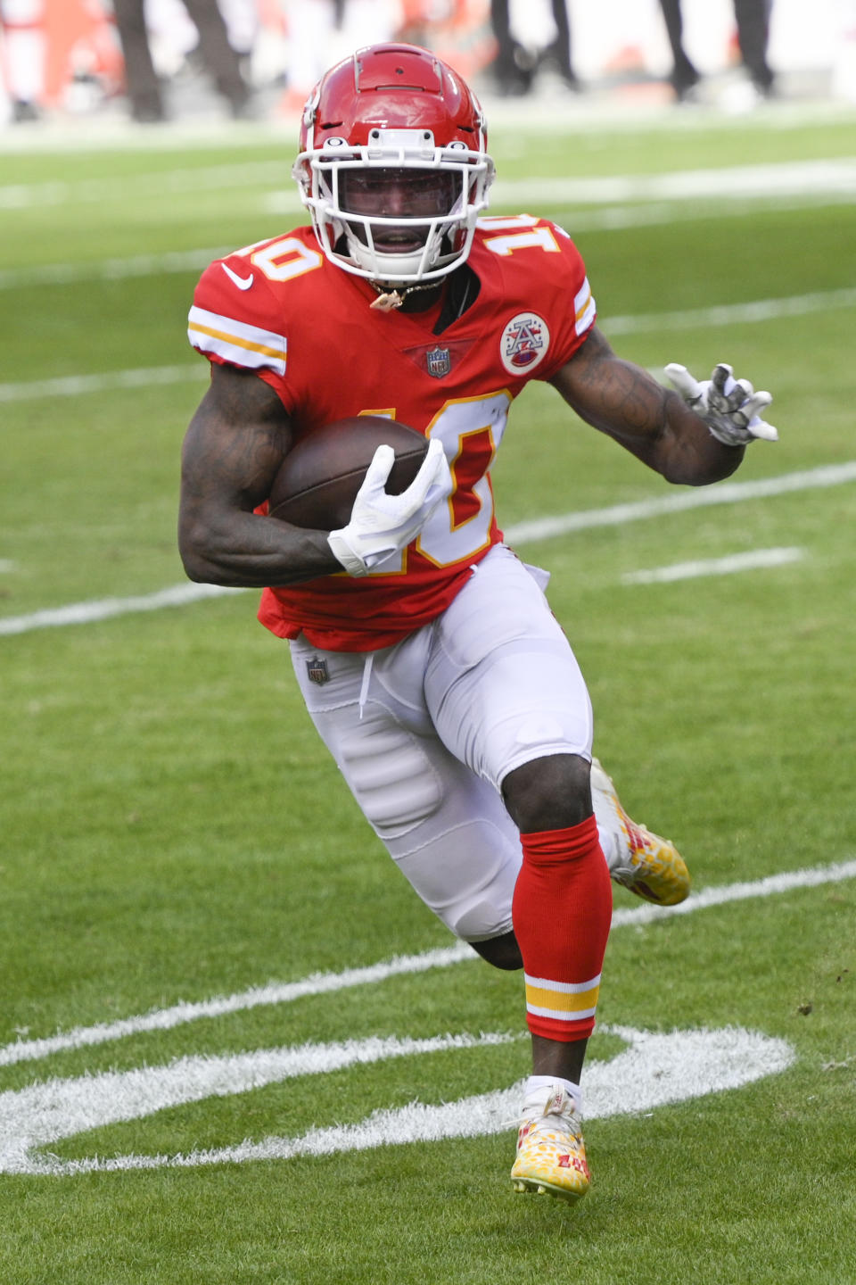 FILE - In this Jan. 17, 2021, file photo, Kansas City Chiefs wide receiver Tyreek Hill (10) runs against the Cleveland Browns during the NFL divisional round football game in Kansas City, Mo. Hill wants to be the Super Bowl halftime show. Hill said Monday, Feb. 1, 2021, he’d be willing to race Tampa Bay receiver Scotty Miller during intermission at Raymond James Stadium on Sunday. (AP Photo/Reed Hoffmann, File)