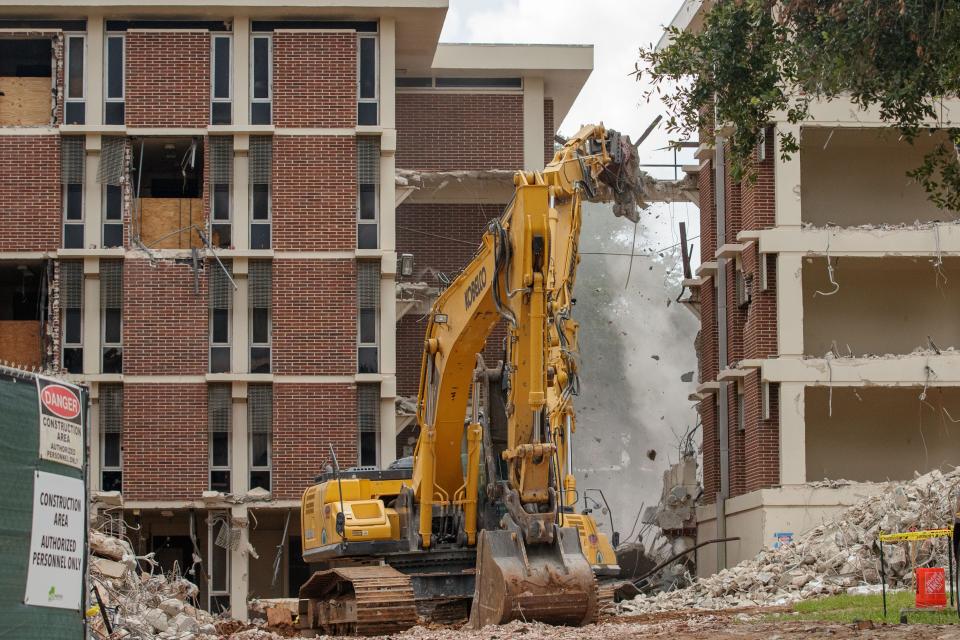 A work crew begins to demolish the Paddyfote Complex at FAMU Wednesday, July 28, 2021.