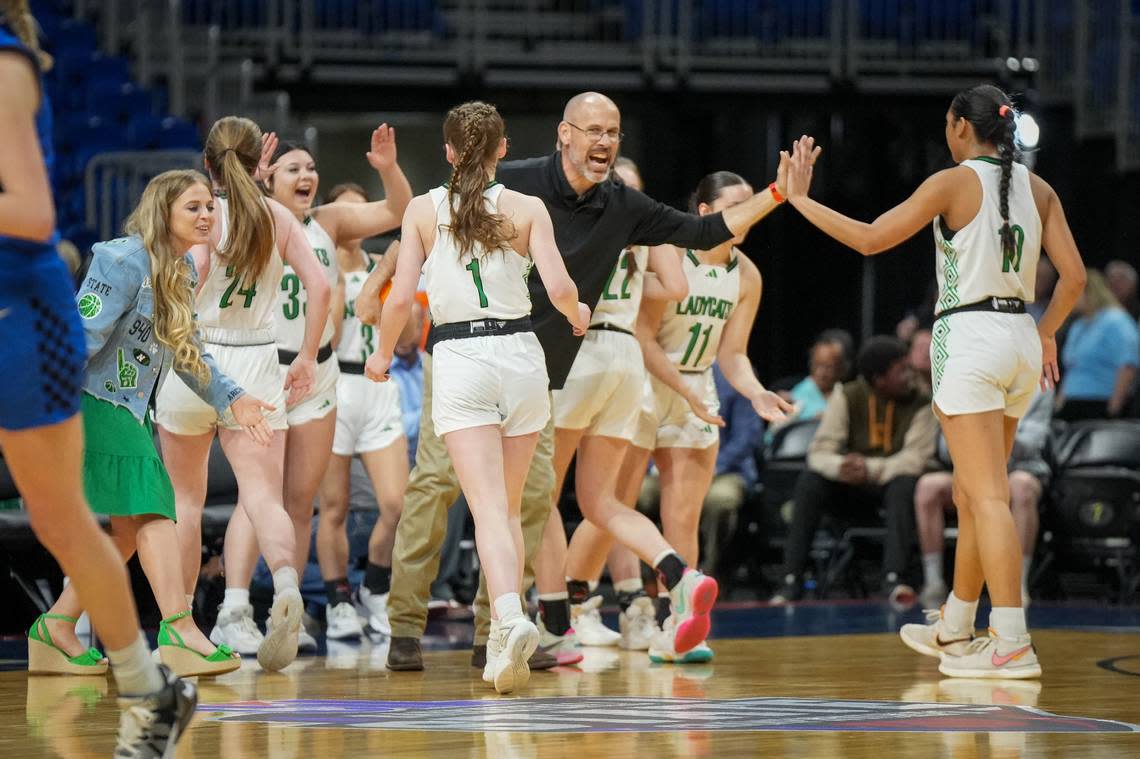 Newcastle coach Ryan Dollar celebrates with his team during a time out. Newcastle defeated Westbrook 59-37 in a Class 1A state semifinal on Thursday, February 29, 2024 at the Alamodome in San Antonio, Texas. Whitney Magness/University Interscholastic League