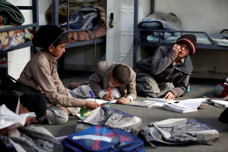 Boys study in a dorm of The al-Shawkani Foundation for Orphans Care in Sanaa, Yemen, January 9, 2017. REUTERS/Khaled Abdullah