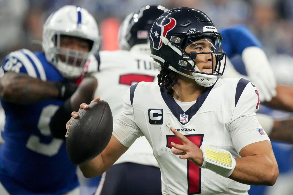 Houston Texans quarterback C.J. Stroud (7) draws back to pass Saturday, Jan. 6, 2024, during a game against the Houston Texans at Lucas Oil Stadium in Indianapolis.