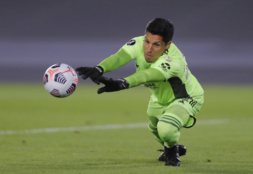 Goalkeeper Enzo Nicolas Perez of Argentina's River Plate stops a ball during a Copa Libertadores soccer match against Colombia's Independiente Santa Fein Buenos Aires, Argentina, Wednesday, May 19, 2021. (Juan Ignacio Roncoroni/Pool via AP)