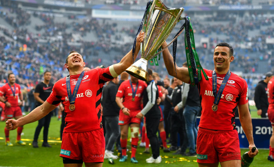 Newcastle Upon Tyne , United Kingdom - 11 May 2019; Alex Goode, left, and Sean Maitland of Saracens celebrate with the cup after the Heineken Champions Cup Final match between Leinster and Saracens at St James' Park in Newcastle Upon Tyne, England. (Photo By Brendan Moran/Sportsfile via Getty Images)