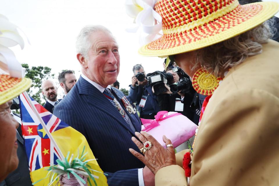 Charles with members of the Nuiean community (PA Wire/PA Images)