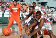 Rakeem Christmas #25 of the Syracuse Orange vies for the ball between JJ O'Brien #20 and Deshawn Stephens #23 of the San Diego State Aztecs during the second half of the Battle On The Midway on board the USS Midway Aircraft Carrier on November 11, 2012 in San Diego, California. (Photo by Harry How/Getty Images)