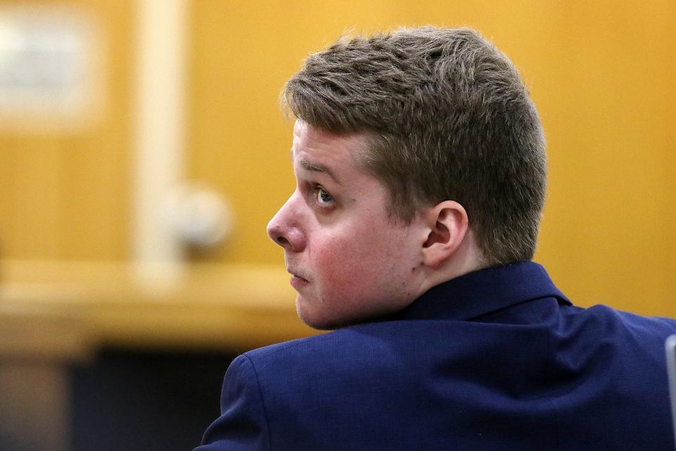 Liam McAtasney, who is charged with the murder of former high school classmate, Sarah Stern, listens to Carlos Diaz-Cobo, defense attorney, make his closing arguments during trial before Superior Court Judge Richard W. English at the Monmouth County Courthouse in Freehold, NJ Friday, February 22, 2019.  