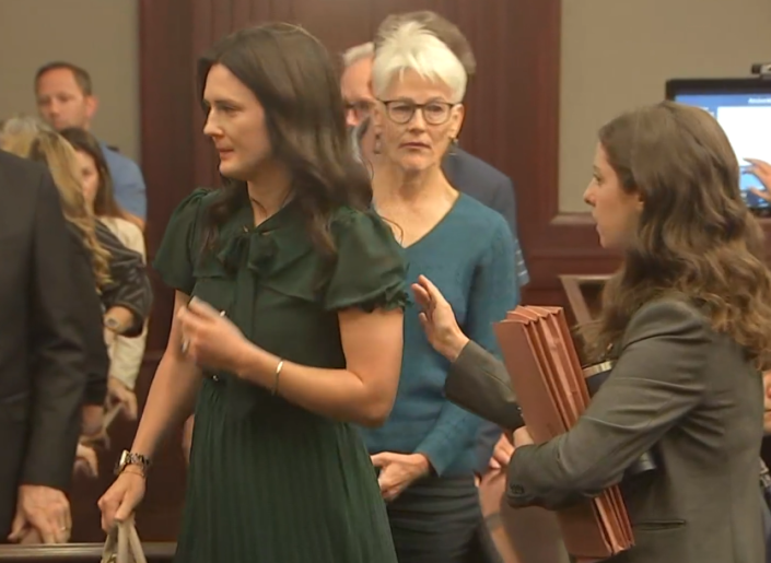 Kirsten Bridegan, left, Jared Bridegan's widow, is consoled by Assistant State Attorney Christina Stifler, right, following Wednesday's hearing announcing the state's intent to seek the death penalty against Mario Fernandez Saldana. Kirsten's mother, center, also attended the Duval County Courthouse hearing.