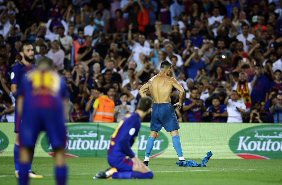 Real Madrid’s Cristiano Ronaldo, right back, celebrates after scoring during the Spanish Supercup, first leg, soccer match between FC Barcelona and Real Madrid at the Camp Nou stadium in Barcelona, Spain, Sunday, Aug. 13, 2017. (AP Photo/Manu Fernandez)
