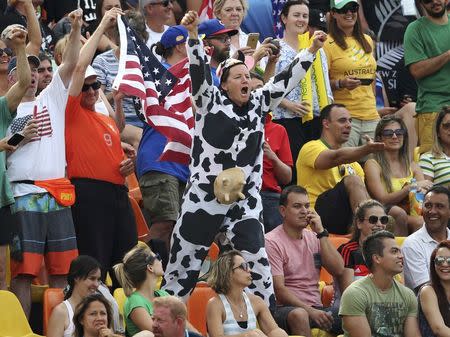 A fan dressed as a cow cheers on from the stands during the rugby. REUTERS/Alessandro Bianchi