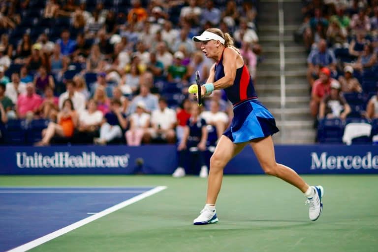 Tough night: Second-seeded Caroline Wozniacki falls in straight sets to Lesia Tsurenko in the second round of the US Open on Thursday