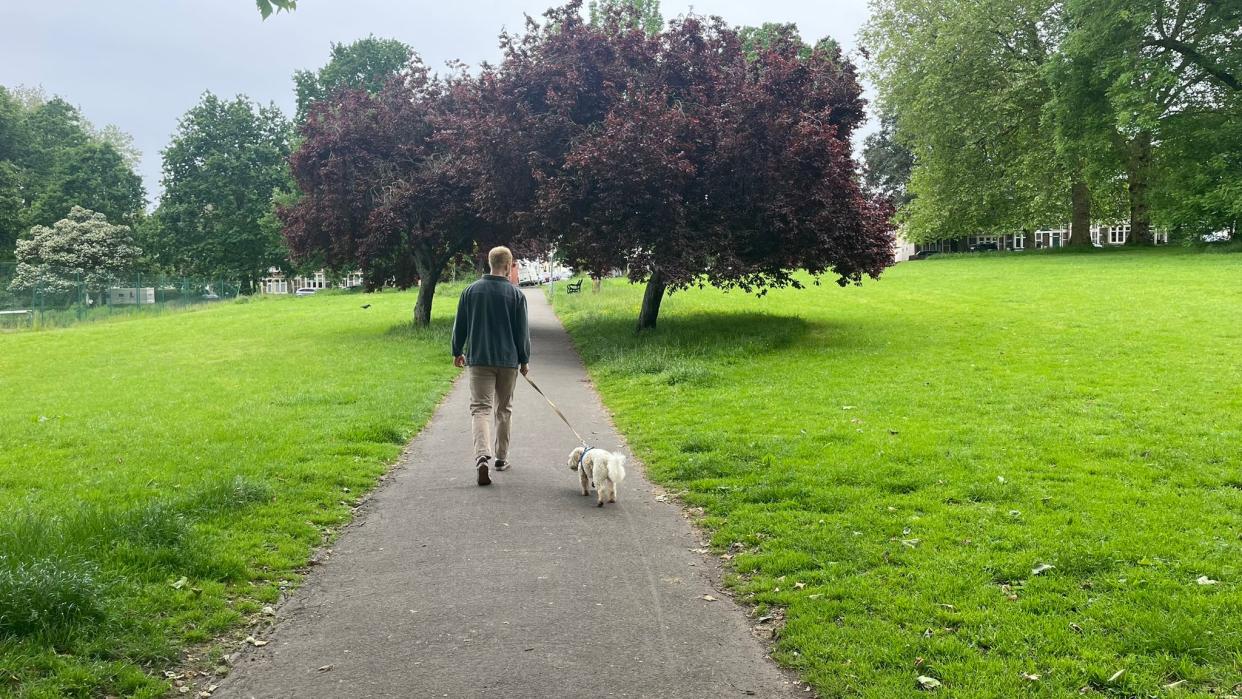  TechRadar fitness writer Harry Bullmore on a walk with his dog . 