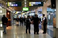 German police officers stand together in the terminal at Duesseldorf airport March 24, 2015. REUTERS/Ina Fassbender