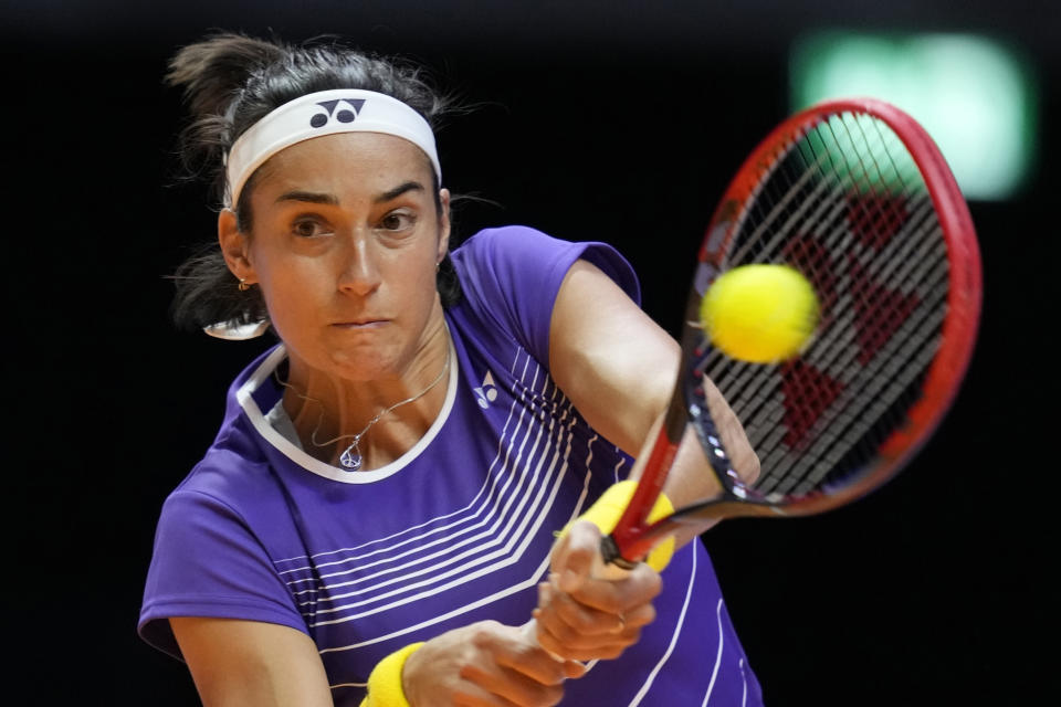 FILE - Caroline Garcia returns the ball to Paula Badosa during a match of the World Tennis League at Coca-Cola Arena, in Dubai, United Arab Emirates, Wednesday, Dec. 21, 2022. The 2023 Grand Slam season begins at the Australian Open next week. (AP Photo/Kamran Jebreili, File)