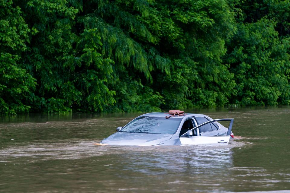 A flooded car on Columbia Pike after a flash flood in Oakland Mills, Maryland, USA, 27 May 2018. The National Weather Service stated as much as 9.5 inches of rain fell in the area. Flash floods ravage Maryland, Oakland Mills, USA - 27 May 2018