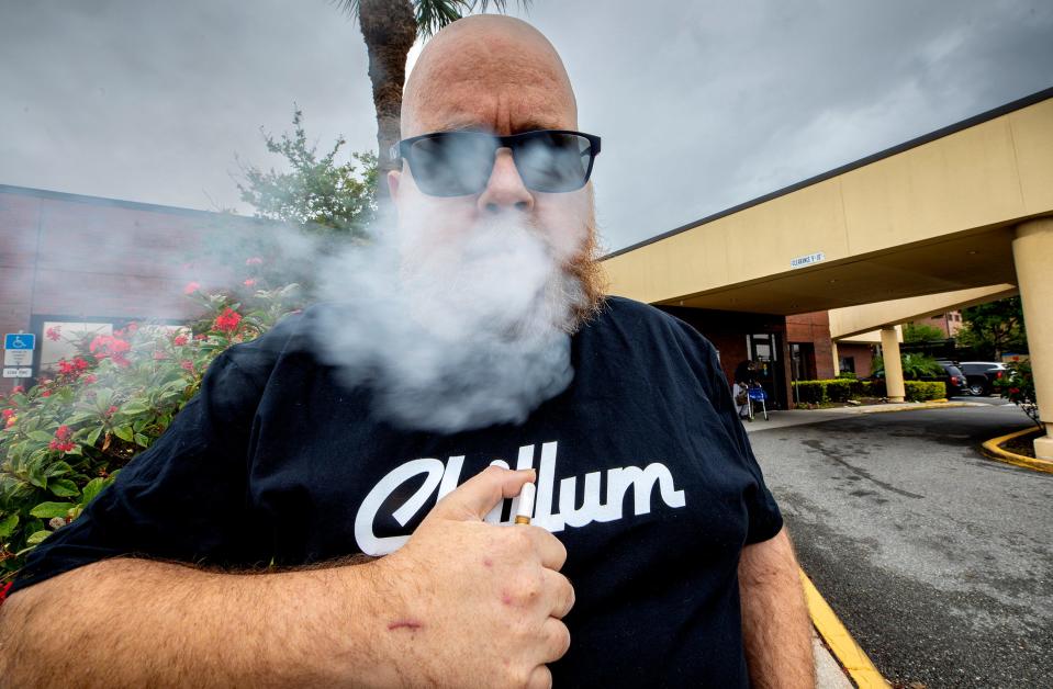 Morgan Haas vapes before a dialysis appointment in April. He was an outspoken opponent of a hemp bill that, in its original form, could have made products more expensive and hard to find for patients and hurt hemp-industry businesses. The bill passed, but with some of the provisions removed.