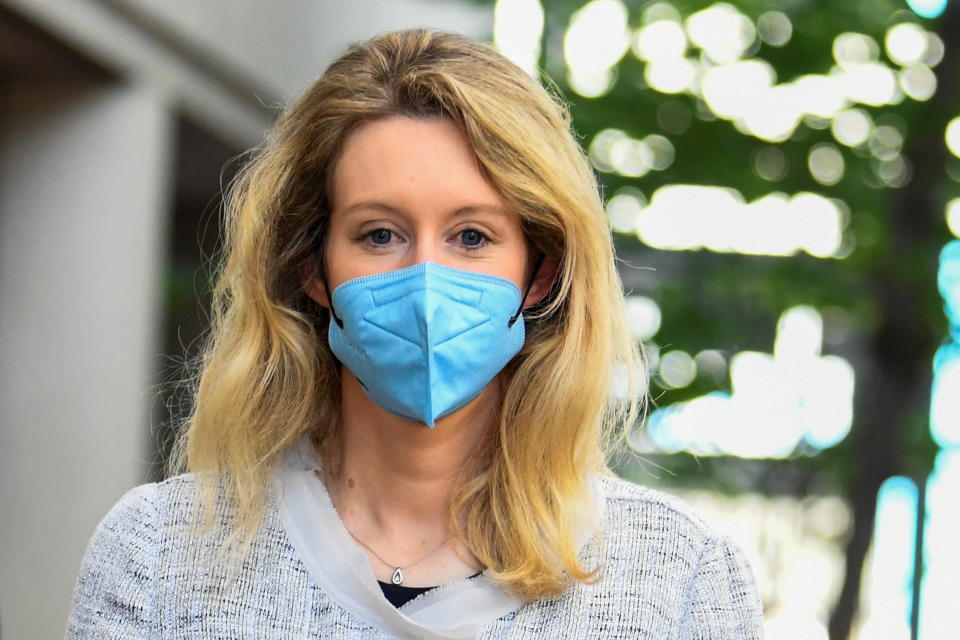 Theranos founder Elizabeth Holmes exits Robert F. Peckham U.S. Courthouse after the first day of federal court hearings in San Jose, California, U.S. May 4, 2021.  REUTERS/Kate Munsch